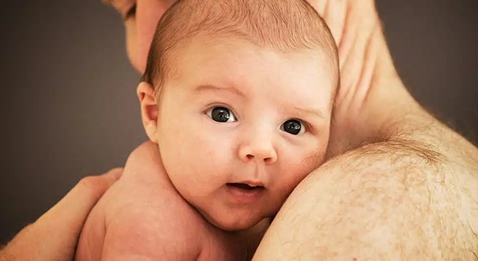 father holding baby