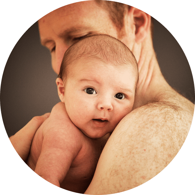 father holding baby