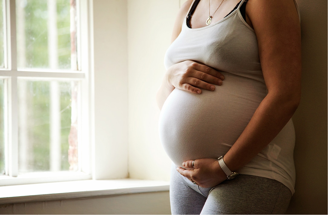 pregnent women by window